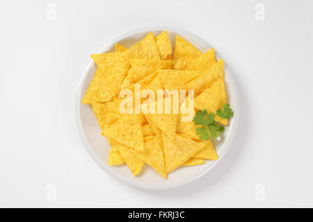 plate of tortilla chips on white background Stock Photo