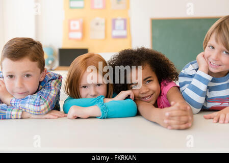 Students smiling in classroom Stock Photo