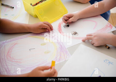 Students drawing in classroom Stock Photo
