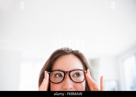 Mixed race woman wearing eyeglasses Stock Photo