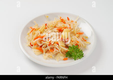 plate of carrot and bean sprouts salad on white background Stock Photo