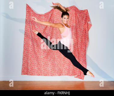 Mixed race dancer practicing in studio Stock Photo