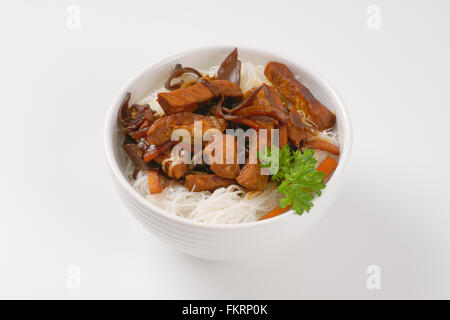 bowl of roasted meat, ear mushrooms and rice noodles on white background Stock Photo