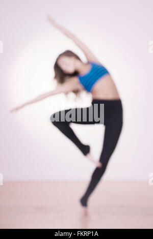 Mixed race dancer practicing in studio Stock Photo