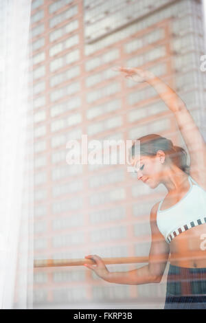 Mixed race dancer practicing in studio Stock Photo