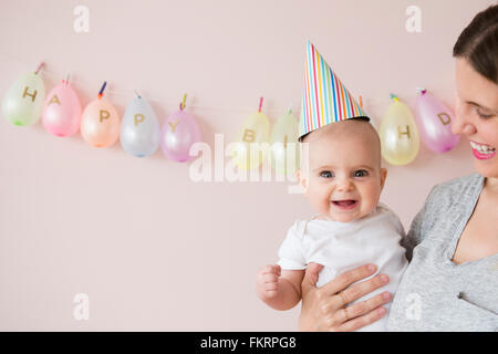 Caucasian mother and daughter celebrating birthday Stock Photo