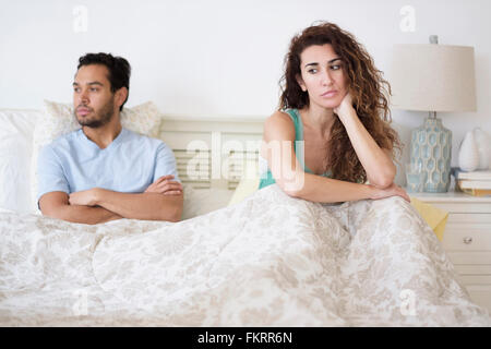Couple arguing in bed Stock Photo
