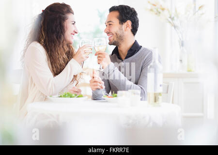 Couple toasting each other with wine Stock Photo