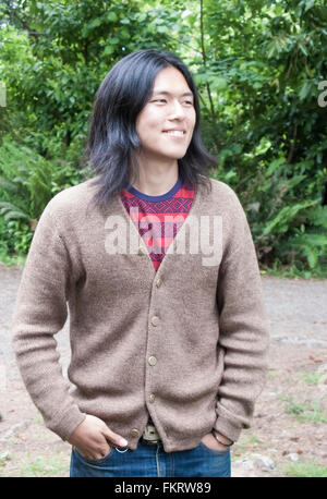 Japanese man standing outdoors Stock Photo