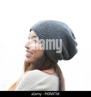 Japanese woman wearing beanie outdoors