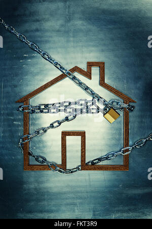 House shape locked in chains Stock Photo