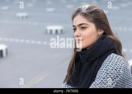 Side view of young woman outdoors Stock Photo