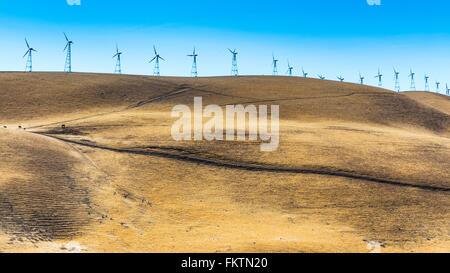 Low angle view of wind turbines on rolling landscape, California, USA Stock Photo