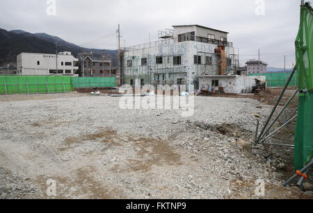 Tokyo. 5th Mar, 2016. Photo taken on March 5, 2016 shows a building being renovated in Ofunato of Iwate Prefecture, northeastern Japan. Those who were evacuated after the monstrous earthquake and tsunami hit Japan's Tohoku area, or northeastern part of the island country, never imagined they'd be staying in temporary housing five years after the disaster, fighting against loneliness and diseases as public housing projects funded by the government are delayed meaning unbearable costs for those without work. © Liu Tian/Xinhua/Alamy Live News Stock Photo