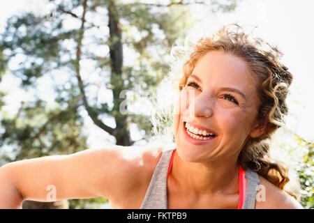 Young woman looking away smiling, portrait Stock Photo