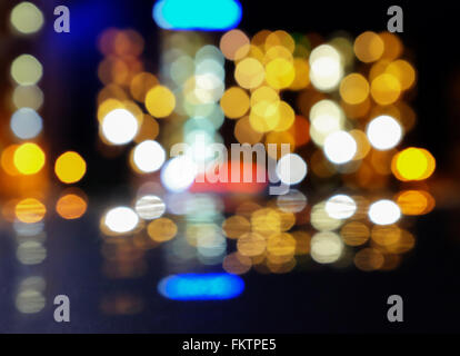 Artistic style - Defocused urban abstract texture ,bokeh of city lights in the background with blurring lights Stock Photo