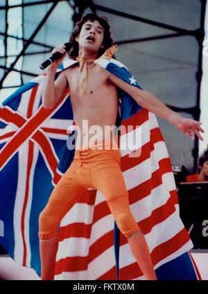 MICK JAGGER CONCERT PHOTO WEARING PHILADELPHIA EAGLES JERSEY DURING JFK  STADIUM CONCERT (9/26/1981)