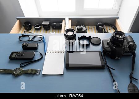 Overhead view of digital tablet and camera equipment on studio desk Stock Photo