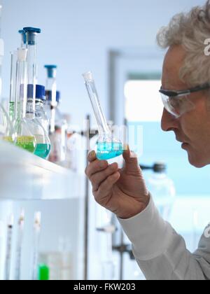 Chemist preparing chemical formula for testing in laboratory Stock Photo