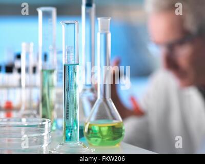 Scientist preparing chemical experiment in laboratory Stock Photo