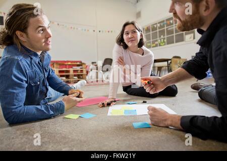 People brainstorming in meeting Stock Photo