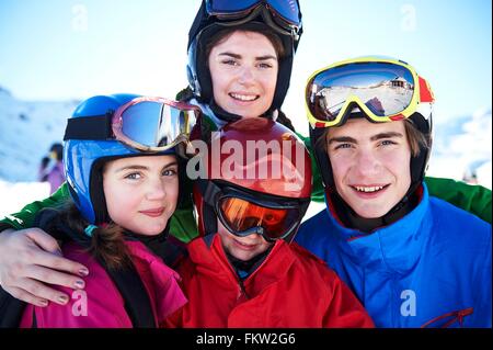 Sisters and brothers on skiing holiday Stock Photo