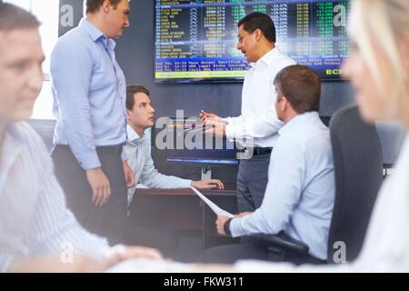 Colleagues in  fice having discussion Stock Photo