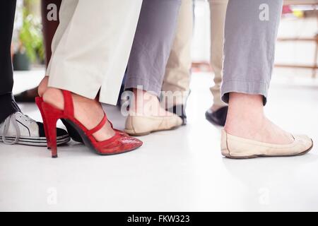 Cropped view   colleagues feet in huddle Stock Photo