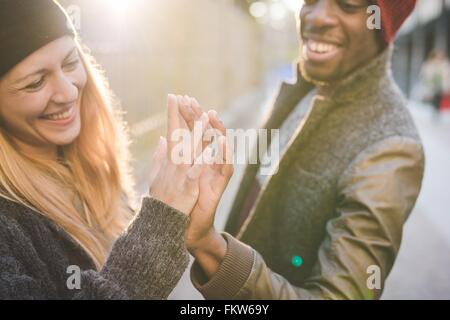 Couple doing high five Stock Photo