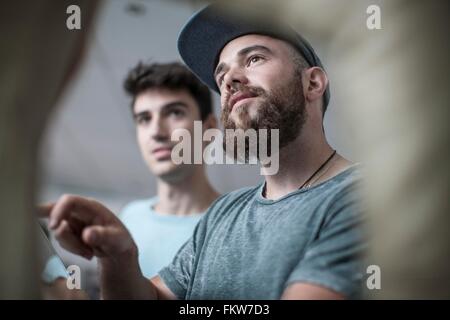 Two young men at office reception Stock Photo