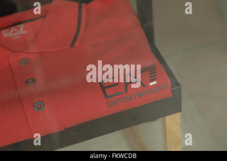 Red Giorgio Armani polo shirt - S.p.A, is an Italian fashion house founded by Giorgio Armani Stock Photo