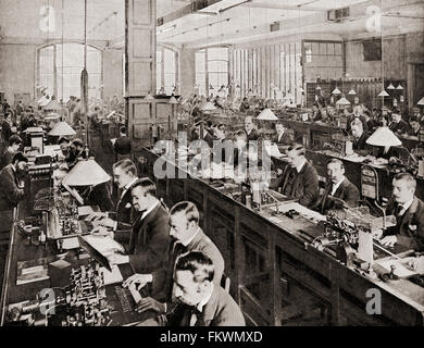 Men at work sending and receiving telegraph messages in the General Post Office's submarine cable room at St Martin's le Grand, London, England in the late 19th century. Stock Photo