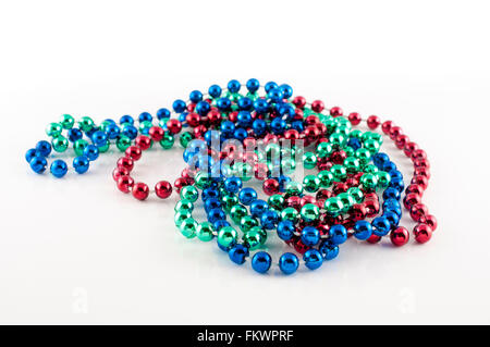 Mardi Gras beads with different colors: red, green and blue isolated on white background Stock Photo