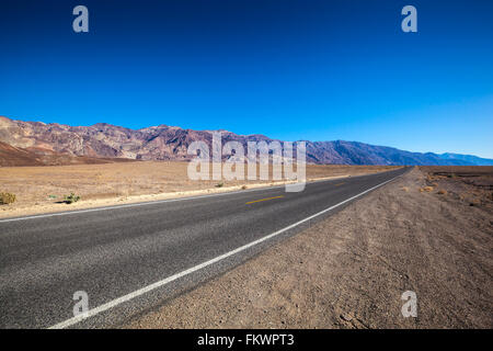 Endless straight road in Death Valley National Park Stock Photo