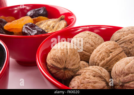 walnuts and various dried fruits on the white background Stock Photo