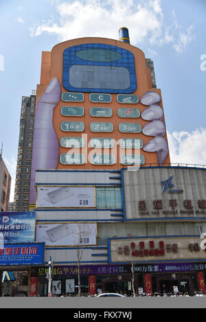 Kunming, Kunming, CHN. 10th Mar, 2016. A phone-shaped mall in Kunming. The buttons are windows and the screen is the top hall. It is considered as one of the most ugly buildings in a website's vote. © SIPA Asia/ZUMA Wire/Alamy Live News Stock Photo