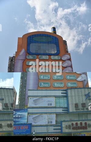 Kunming, Kunming, CHN. 10th Mar, 2016. A phone-shaped mall in Kunming. The buttons are windows and the screen is the top hall. It is considered as one of the most ugly buildings in a website's vote. © SIPA Asia/ZUMA Wire/Alamy Live News Stock Photo