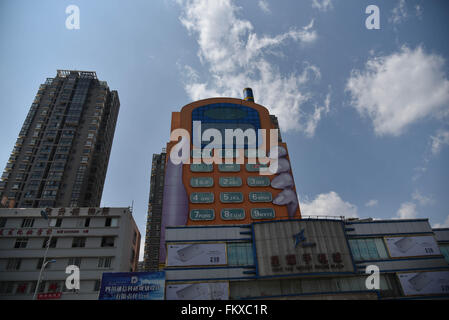 Kunming, Kunming, CHN. 10th Mar, 2016. A phone-shaped mall in Kunming. The buttons are windows and the screen is the top hall. It is considered as one of the most ugly buildings in a website's vote. © SIPA Asia/ZUMA Wire/Alamy Live News Stock Photo