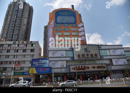 Kunming, Kunming, CHN. 10th Mar, 2016. A phone-shaped mall in Kunming. The buttons are windows and the screen is the top hall. It is considered as one of the most ugly buildings in a website's vote. © SIPA Asia/ZUMA Wire/Alamy Live News Stock Photo