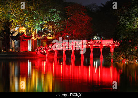 Red bridge reflecting on water, Ngoc Son Temple (Temple of the Jade Mountain), Hoan Kiem Lake, Old Quarter, Hanoi, Vietnam Stock Photo