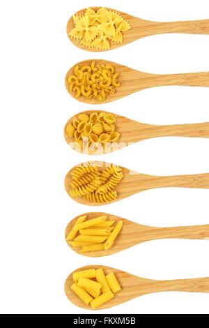 Spoons filled with various dry pasta over a white background Stock Photo