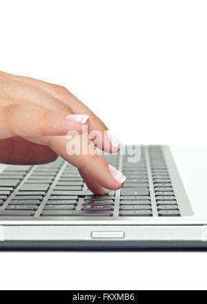 Macro photo of female hand typing on laptop Stock Photo