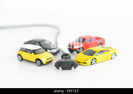 Electric cars concept with many toys vehicles on white background Stock Photo