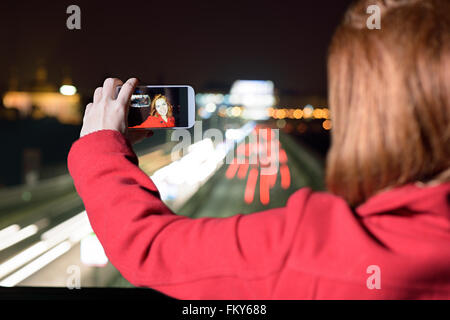 Red head woman, taking a selfie. Stock Photo