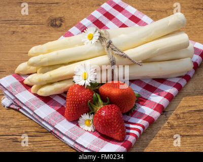 Asparagus and strawberries on the table Stock Photo