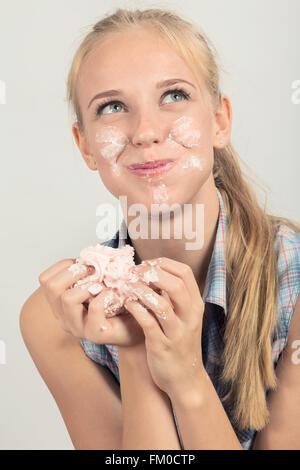 happy fun girl eating dessert Stock Photo