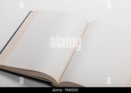 Blank white pages in an open hardcover book. Stock Photo