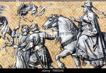 Detail of the Fuerstenzug, Procession of Prince, mural on the wall of the Stallhof, Stables Courtyard, and a mime, Dresden Stock Photo