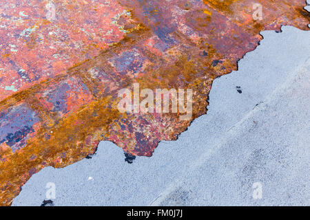 Multicolored old half rusted metal plate background Stock Photo
