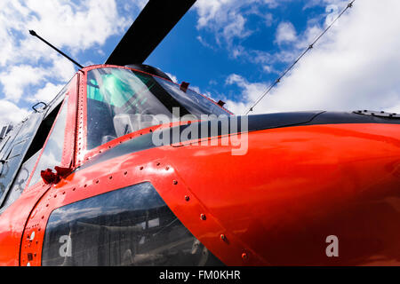 Red helicopter closeup view and details of the body Stock Photo